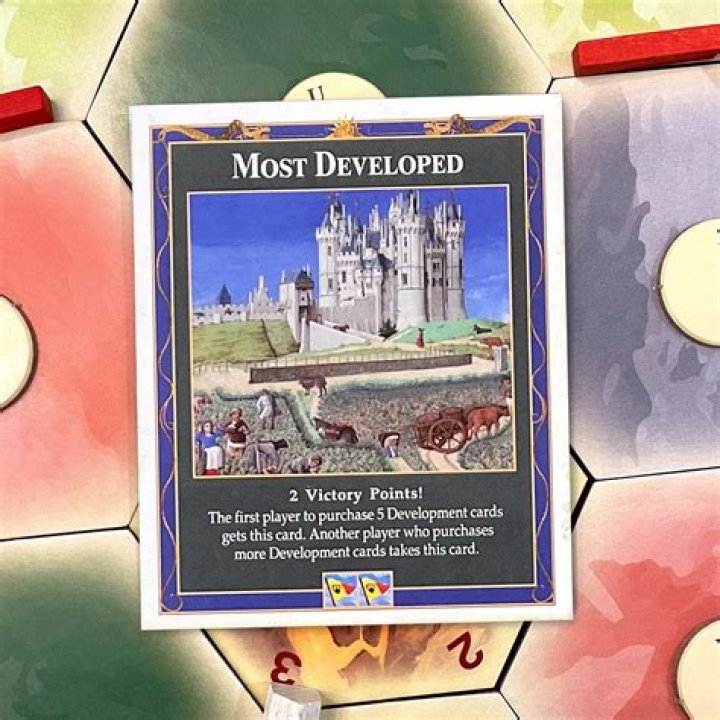 Can you use a development card before you roll?
